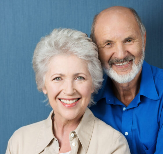 Friendly,Smiling,Senior,Couple,Standing,Close,Together,Looking,At,The Friendly,Smiling,Senior,Couple,Standing,Close,Together,Looking,At,The